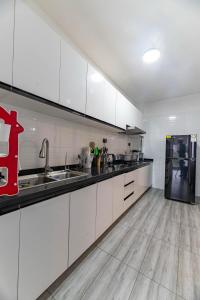 luxury elegant furnished three bedroom apartment with children playing ground,swimming pool relaxing rooftop with amazing city views, ample parking space and proximity to major shopping malls