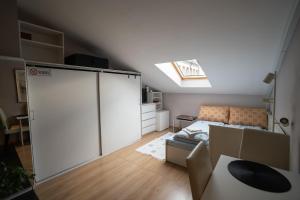 Cosy, workplace studio with a sunny rooftop view