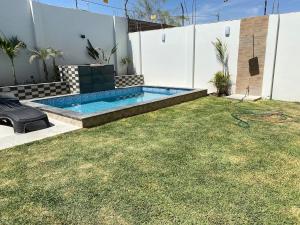 house with pool, grill, bar and garden