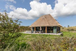 Luxe 8 persoons Welness Villa Nova in het Duingebied tussen Nes en het Strand