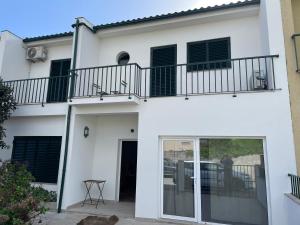 Apartment with balconies and garden