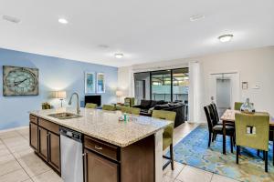 Updated & colorful home w a modern kitchen, furnished lanai, & private pool