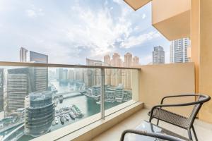Sky-High 1BR with Stunning Direct Marina Views, Steps from the Metro and Offering Seamless Access to Marina Mall, The Address Residences, Dubai Marina by Deluxe Holiday Homes