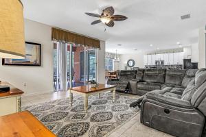 Colorful home with pool, patio, kitchen, washerdryer, & game room