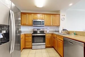 Lakefront condo with amazing views, pool, & hot tub - steps from the beach