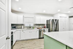 Dog-friendly lakefront home with fast WiFi, central AC, patio, & game room