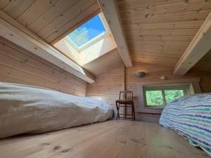 Traditional Log House Near Beach And Forest