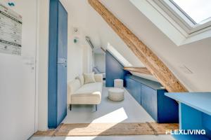 Bright studio with a view over the rooftops of Paris 9th