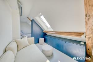 Bright studio with a view over the rooftops of Paris 9th