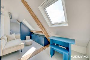 Bright studio with a view over the rooftops of Paris 9th