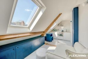 Bright studio with a view over the rooftops of Paris 9th