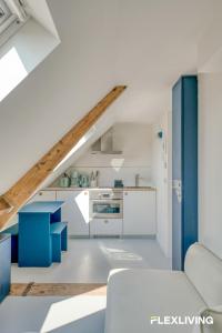 Bright studio with a view over the rooftops of Paris 9th