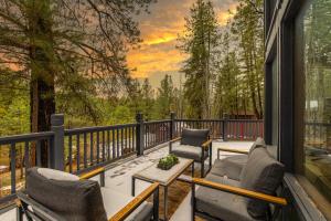 Modern Mountain Chalet with Wall-of-Windows Forest Views.