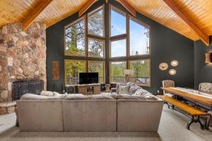 Modern Mountain Chalet with Wall-of-Windows Forest Views.