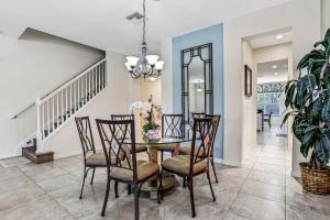 Colorful home with pool, patio, kitchen, washerdryer, & game room