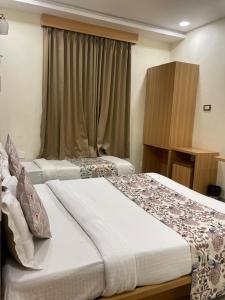 HOTEL AURA BY ARIHANT - Compact Rooms