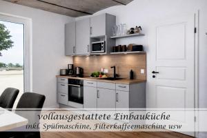 Ferienwohnung Feinheit - Gulfhof nahe Greetsiel mit Sauna, Garten & 3 Schlafzimmern