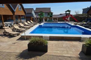 Two-story holiday homes with a summer pool