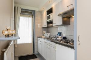 Welcome in - Appartement dichtbij het strand, met fietsenberging en ruim terras