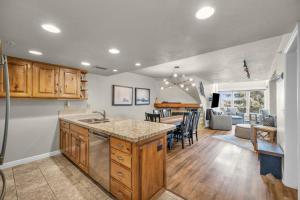 Ski-in - ski-out condo with shared pool & hot tub gas fireplace