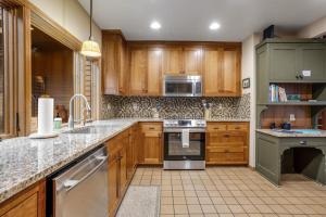 Forested getaway with kitchen stone fireplace pool & private hot tub