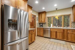 Forested getaway with kitchen stone fireplace pool & private hot tub