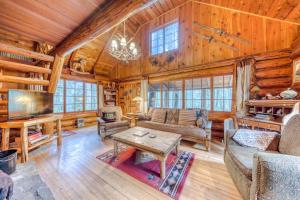 Historic riverfront Steiner cabin in forest with firepit deck & patio lounging