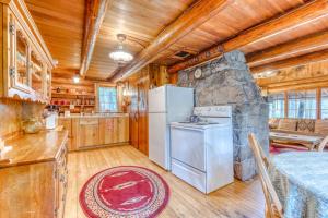 Historic riverfront Steiner cabin in forest with firepit deck & patio lounging