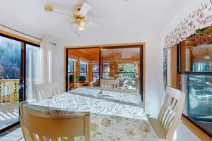 Cozy abode steps from the beach with a private hot tub and nautical theme