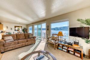 Incredible Riverfront Oasis with Wraparound Deck & Cozy Interior