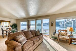 Incredible Riverfront Oasis with Wraparound Deck & Cozy Interior