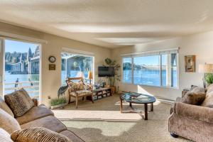 Incredible Riverfront Oasis with Wraparound Deck & Cozy Interior