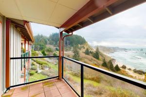 Sweeping Oceanfront Views Await Tranquil Condo with Balcony Beach Access W&D
