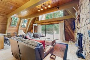 Dog-friendly A-frame cabin with private hot tub - tranquil setting near skiing
