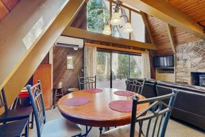 Dog-friendly A-frame cabin with private hot tub - tranquil setting near skiing
