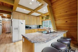 Dog-friendly A-frame cabin with private hot tub - tranquil setting near skiing