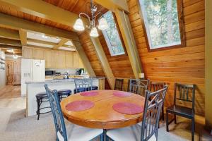 Dog-friendly A-frame cabin with private hot tub - tranquil setting near skiing
