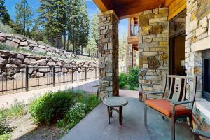 Ski-in-ski-out ground-floor condo with fireplace patio shared pool & hot tub