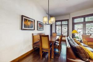Ski-in-ski-out ground-floor condo with fireplace patio shared pool & hot tub