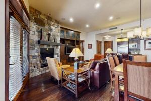 Ski-in-ski-out ground-floor condo with fireplace patio shared pool & hot tub