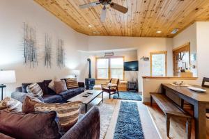 Modern retreat with wooden touches shared hot tub pool sauna basket & tennis