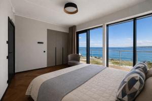 LUXURY WATERFRONT APARTMENTS WITH SEA VIEWS, SUNSET TERRACES and FREE PARKING, ONE WITH A HUUM SAUNA, THE OTHER WITH A BATHTUB