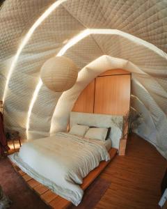 Numie White Gum Cocoon with Hot Tub Waterfront