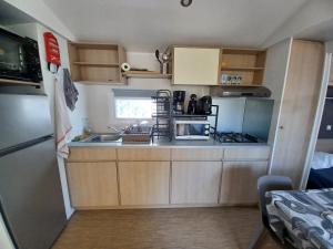 Mobil-home climatisé, tout confort, 3 chambres, sans vis à vis, dans camping 4 étoiles à La Presquile du Barcares
