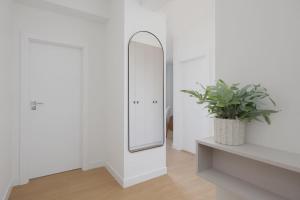 Luxury Two-Bedroom Apartment with a Balcony in Warsaw by Renters Prestige