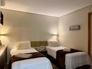 Apartamento Premium - 2 Camas de Solteiro OU 1 Cama de Casal e Sofá Cama-Piscina-Academia-Manobrista-Carregador Veicular-Mini Mercado