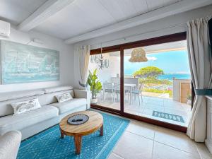 237 Seafront Apartment with Beach Access in Baja Sardinia - by Coral Property