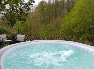 Les Glycines Gîtes - La Roche gîte - shared solar heated pool - garden spa - fenced garden for dogs