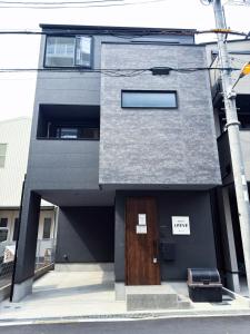 Newly built in 2026 Entire building-single unit with 3 bedrooms-can accommodate 7 people Free parking Direct access to USJ Namba Kyocera Dome