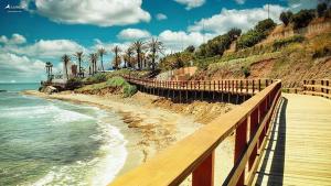 Charming Pet-Friendly Beach Apartment with Private Garden & Pool Access